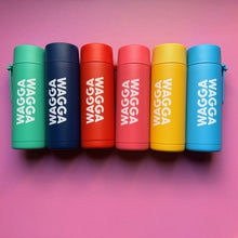 Load image into Gallery viewer, Six colorful bottles with 'WAGGA' branding on a pink background
